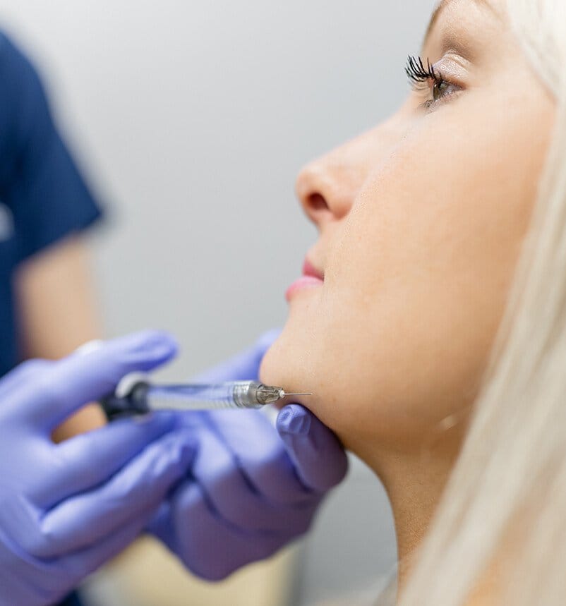woman getting facial injections