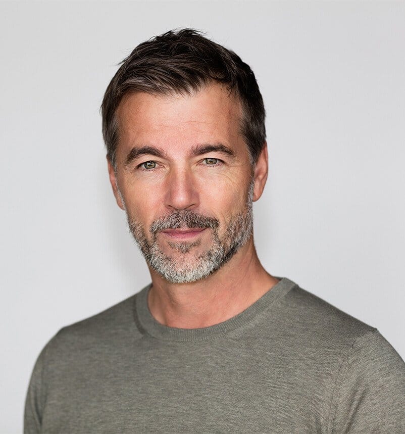 there is a man with a beard and a gray shirt