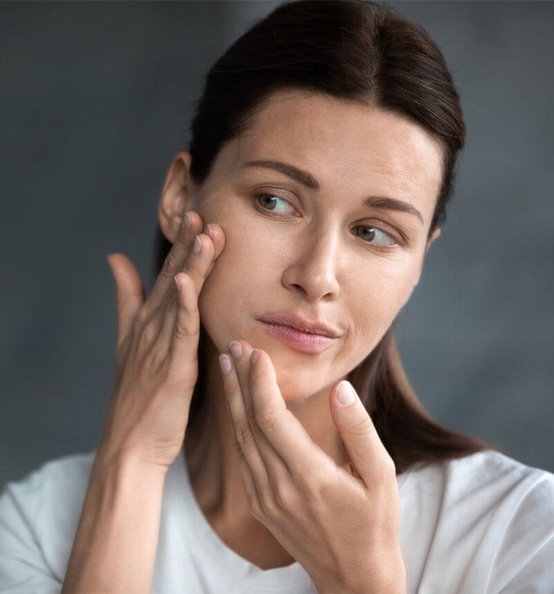 woman touching her skin
