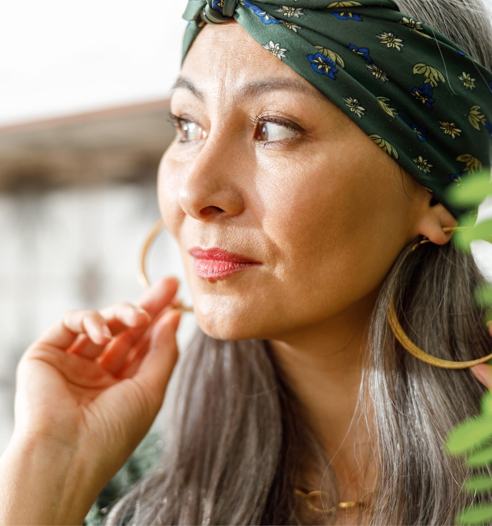 there is a woman with a green headband and a green shirt