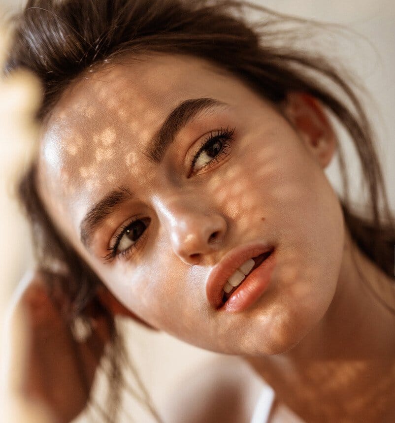 there is a woman with a white shirt and brown hair