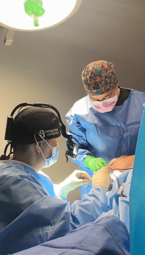 Dr. Young Cho performing facelift surgery on a female patient at Integrated Aesthetics in Spring, TX
